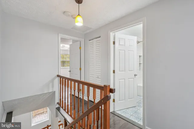 a view of a room with wooden floor