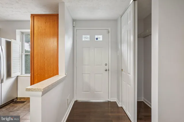 a view of a hallway with windows