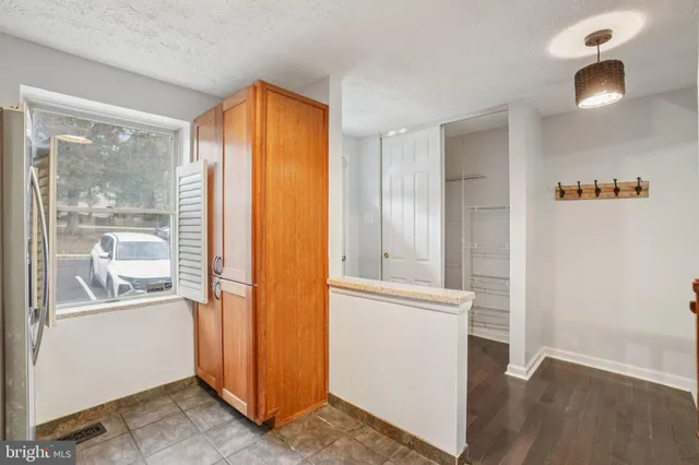 a view of an entryway with wooden floor