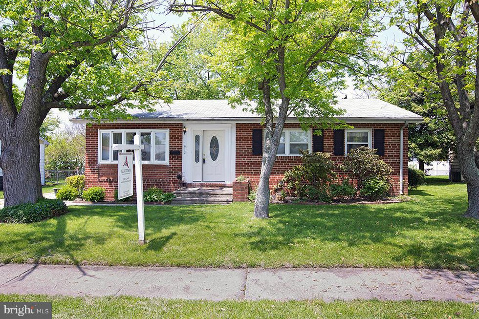 1012 Crosby Road Baltimore, MD 21228 - Photo 1 of 24 a front view of house with yard and green space