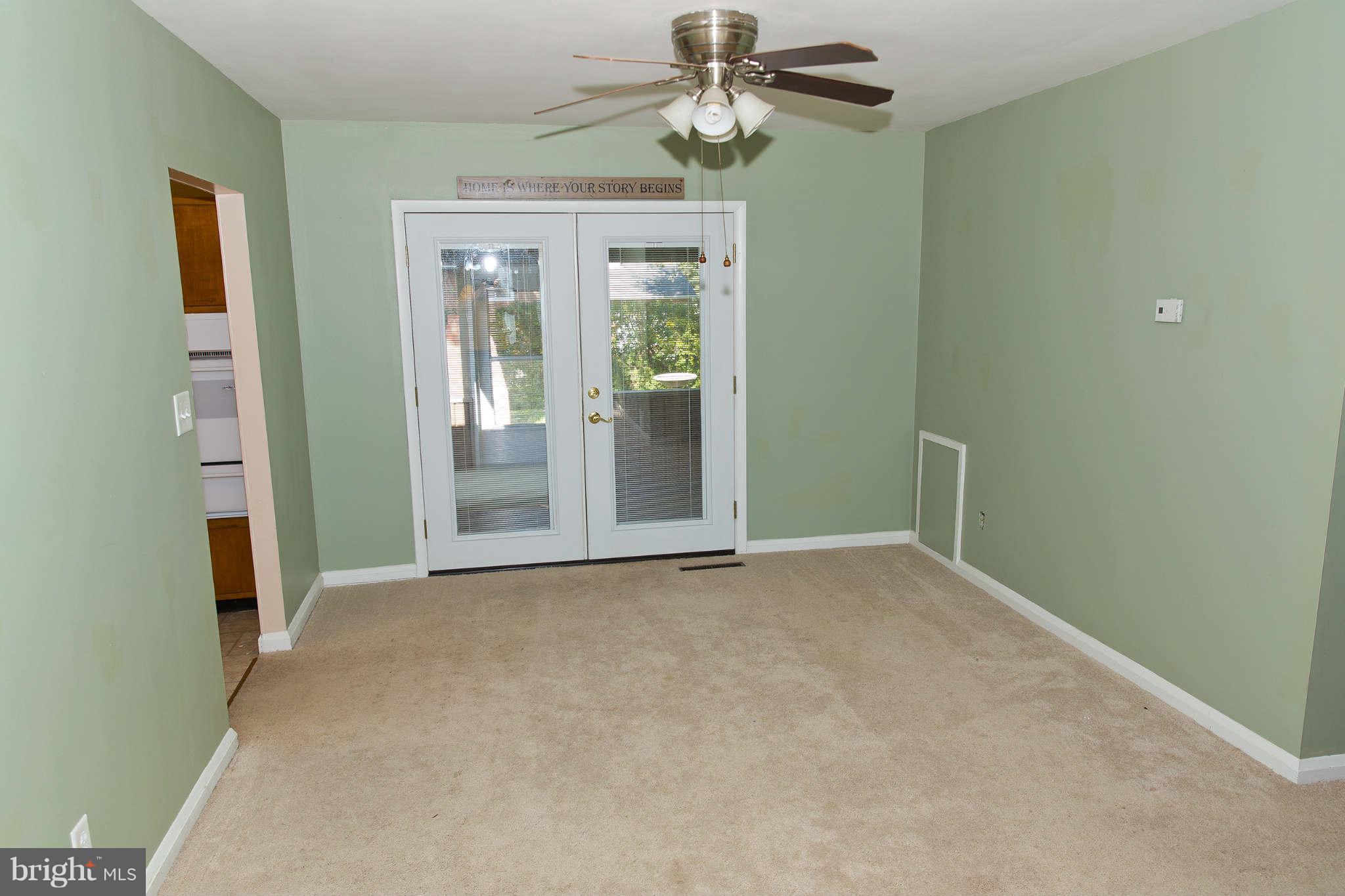 1012 Crosby Road Baltimore, MD 21228 - Photo 4 of 24 a view of an empty room with a window