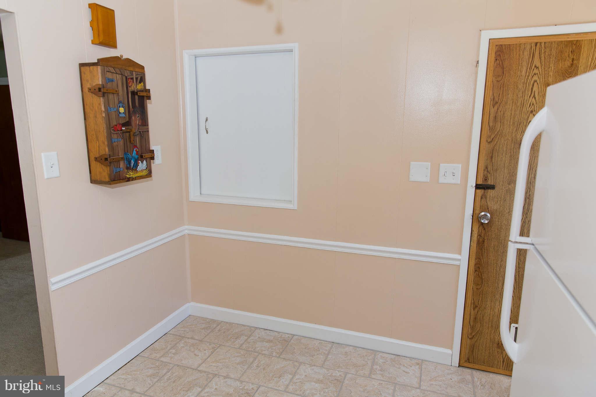 1012 Crosby Road Baltimore, MD 21228 - Photo 7 of 24 a view of an entryway with wooden floor