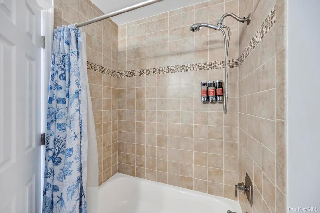 114 Birchwood Road Coram, NY 11727 - Photo 16 of 24 a bathroom with a shower and a shower