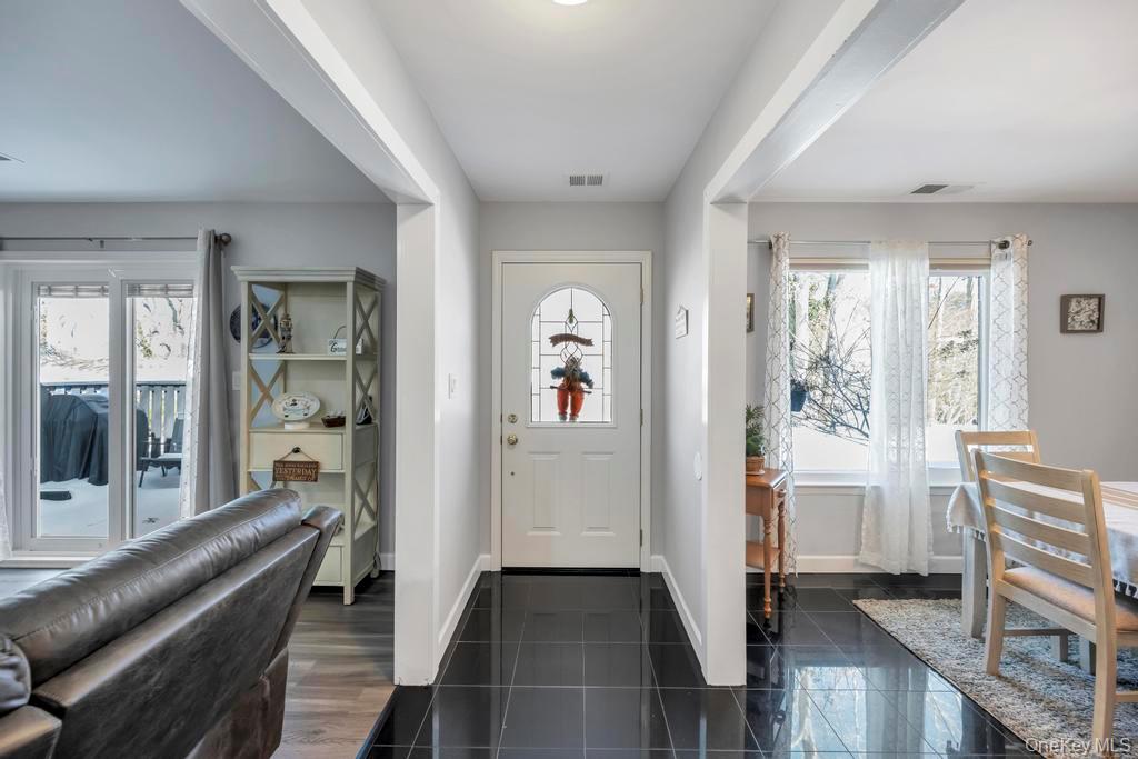 114 Birchwood Road Coram, NY 11727 - Photo 5 of 24 a living room with furniture and a window