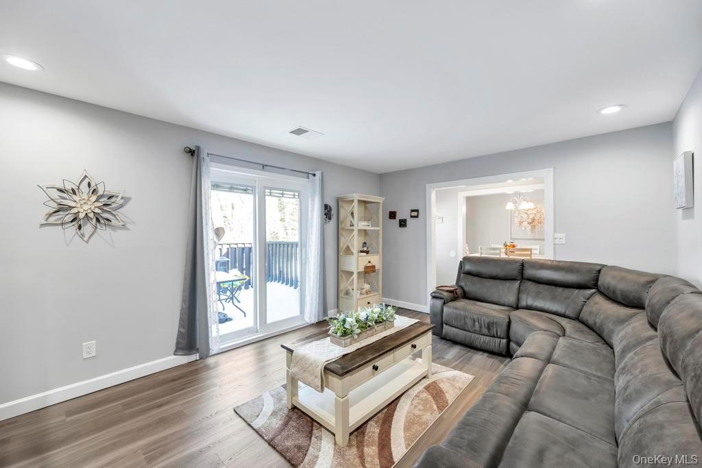 114 Birchwood Road Coram, NY 11727 - Photo 7 of 24 a living room with furniture and a large window