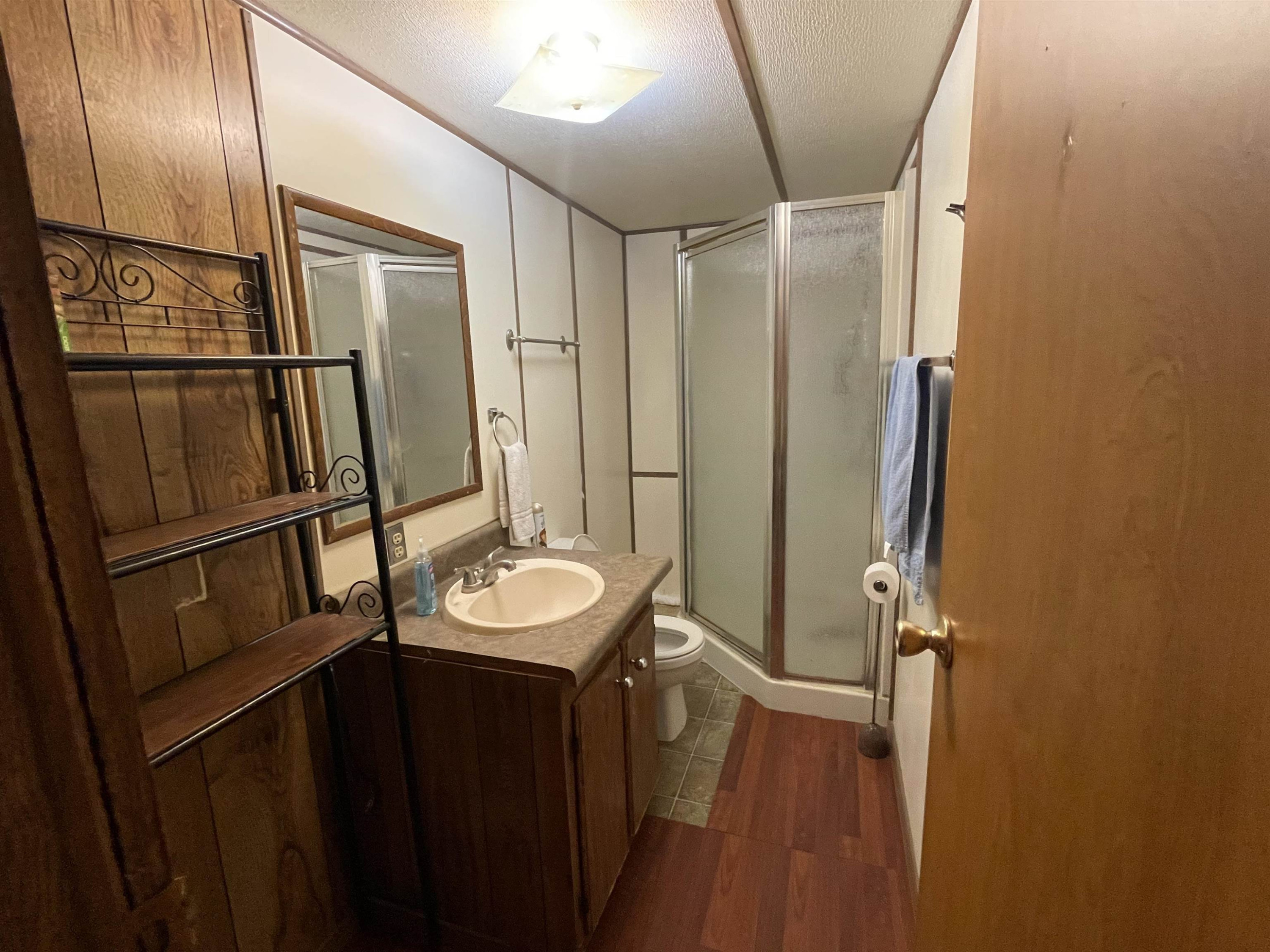 176 Sharp Road Lexington, TN 38351 - Photo 10 of 11 a bathroom with a sink a mirror and a shower