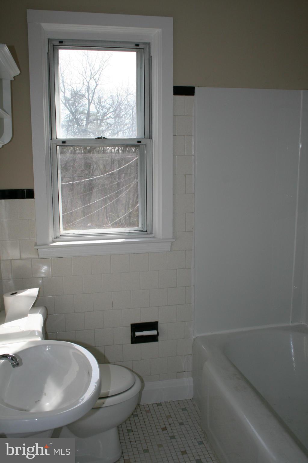503 Welbrook Road Baltimore, MD 21221 - Photo 14 of 24 a bathroom with a toilet and a sink