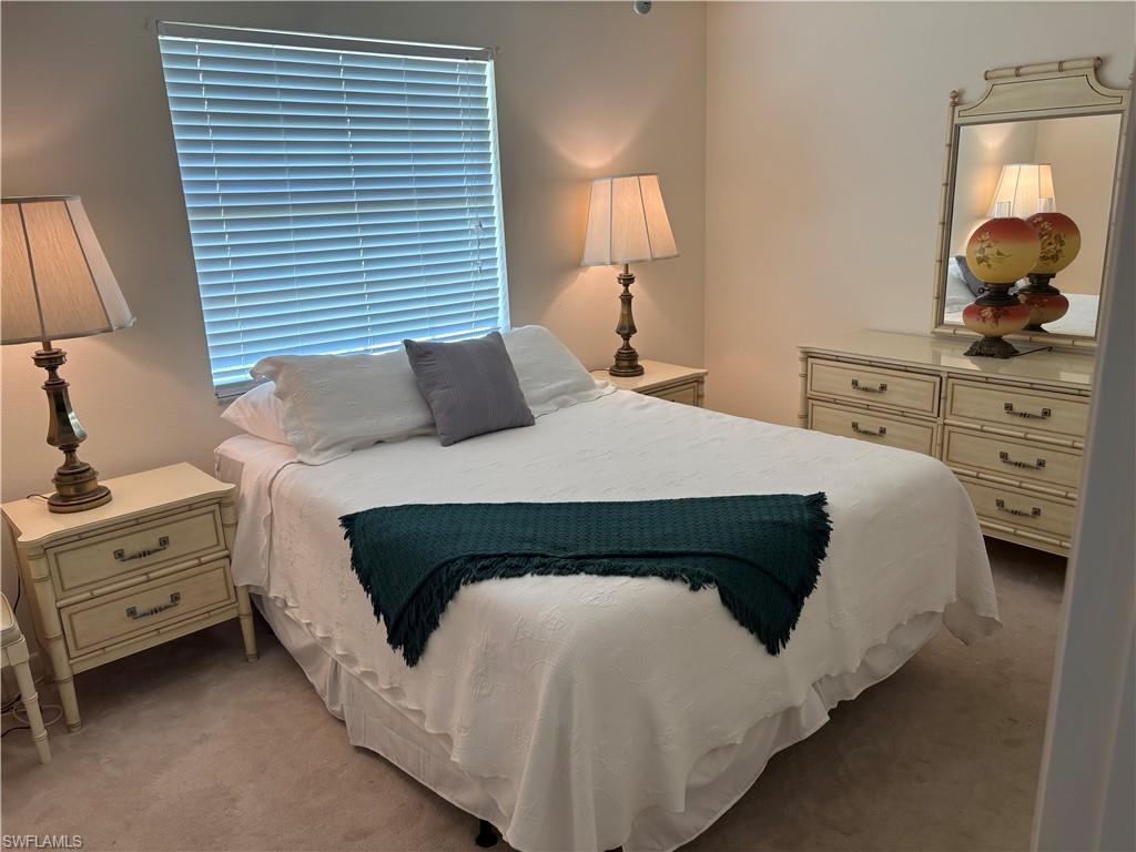 315 St Andrews Boulevard, Unit A2 Naples, FL 34113 - Photo 9 of 17 View of carpeted bedroom