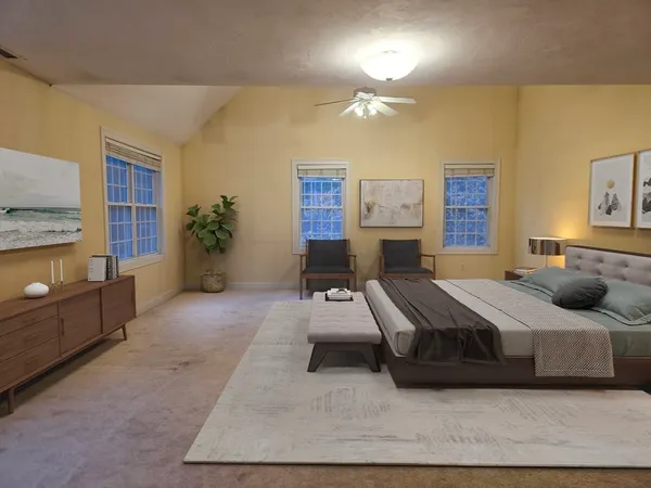 a bedroom with a bed and window