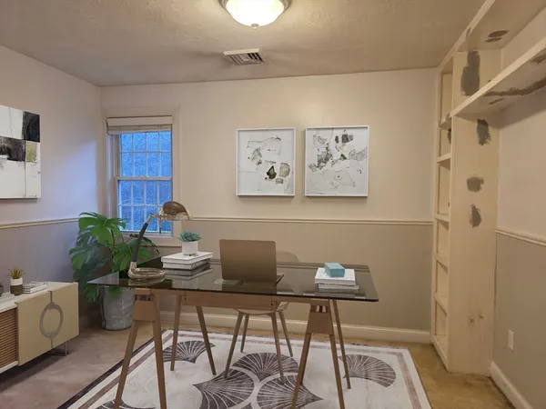 a work room with furniture and wooden floor