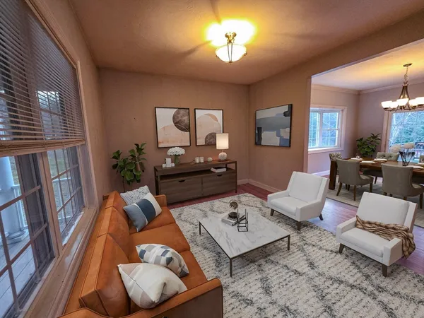 a living room with furniture and a chandelier