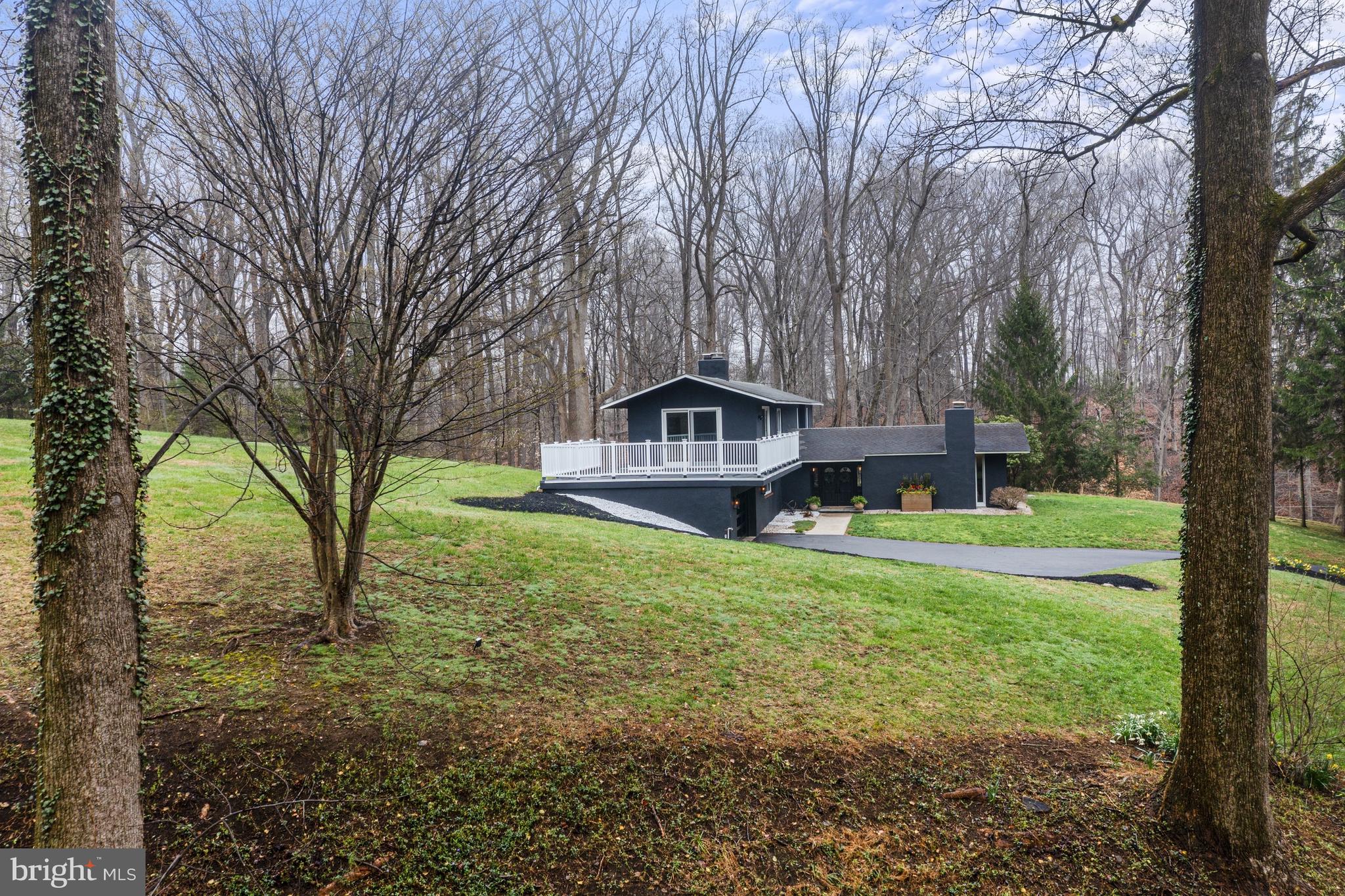 2 Walnut Ridge Road Greenville, DE 19807 - Photo 3 of 38 a front view of a house with garden