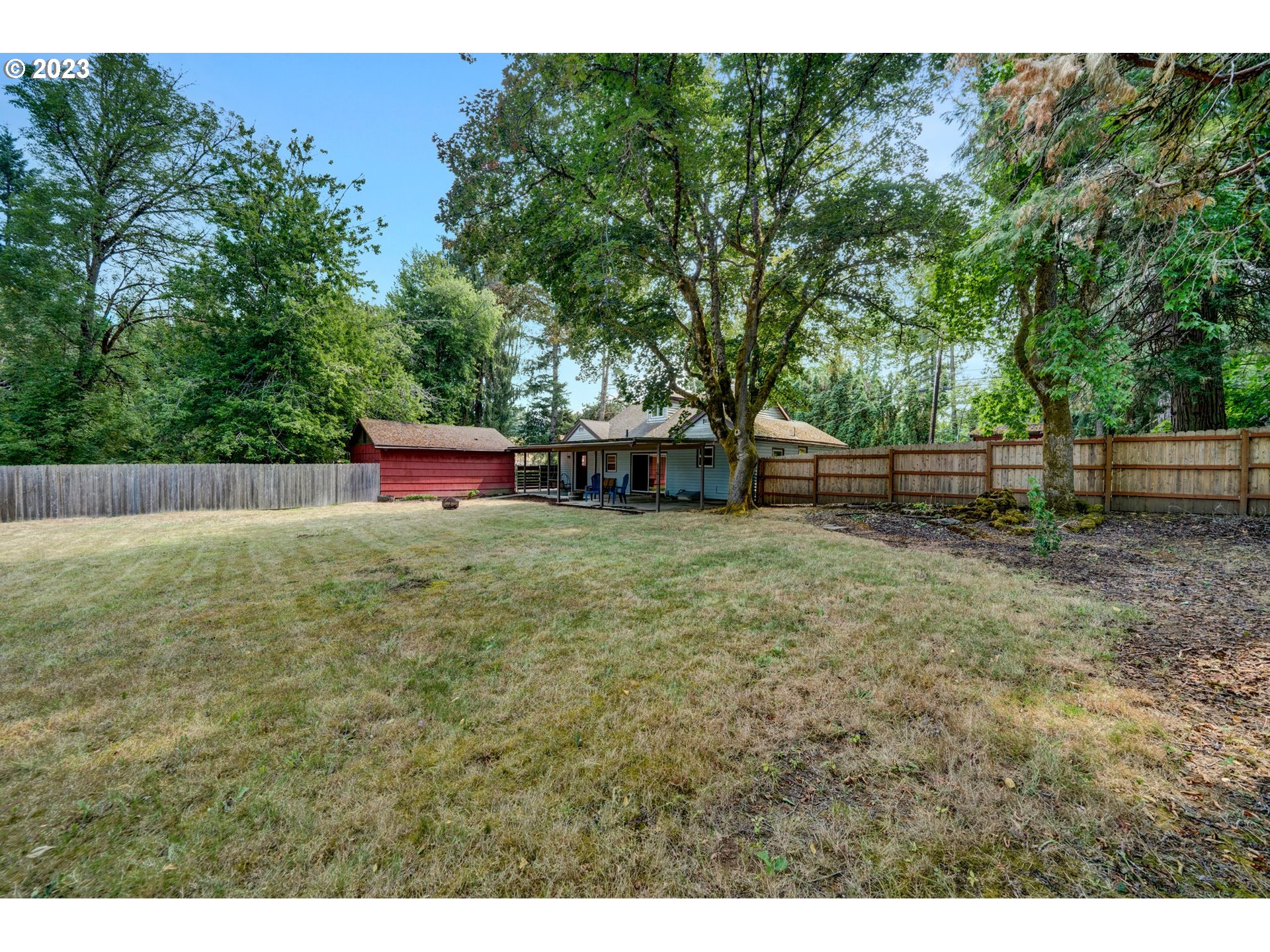 24065 Southeast Tillstrom Road Damascus, OR 97089 - Photo 29 of 38 a backyard of a house with lots of green space