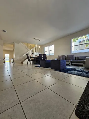 a lobby with furniture and window