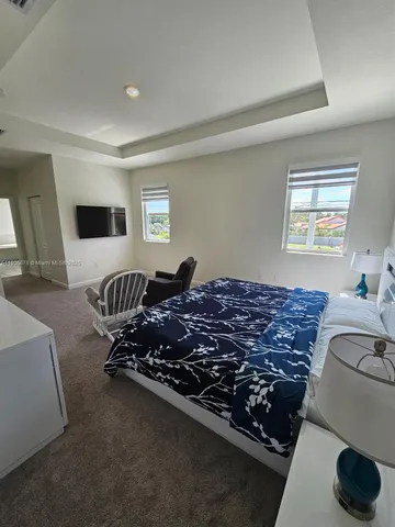 a bed room with furniture and a window