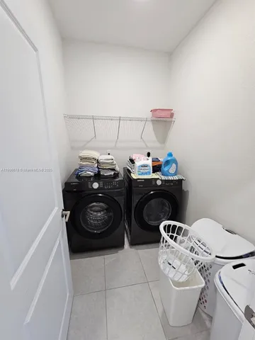 a table and a stove sitting inside of a kitchen