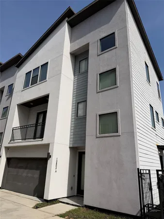 a front view of a house with garage