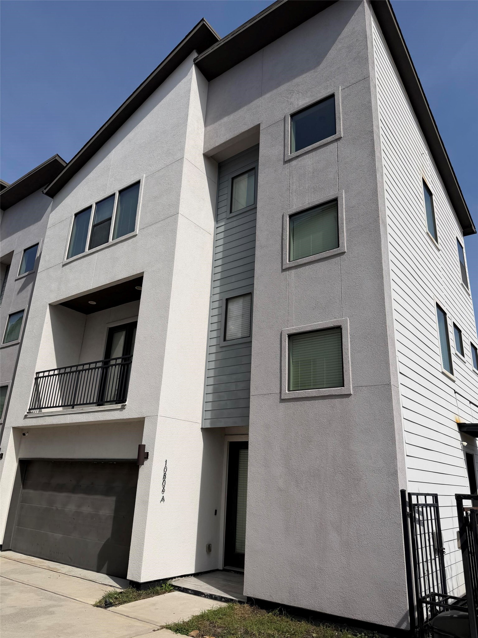 10806 Warwana Road, Unit A Houston, TX 77043 - Photo 1 of 37 a front view of a house with garage