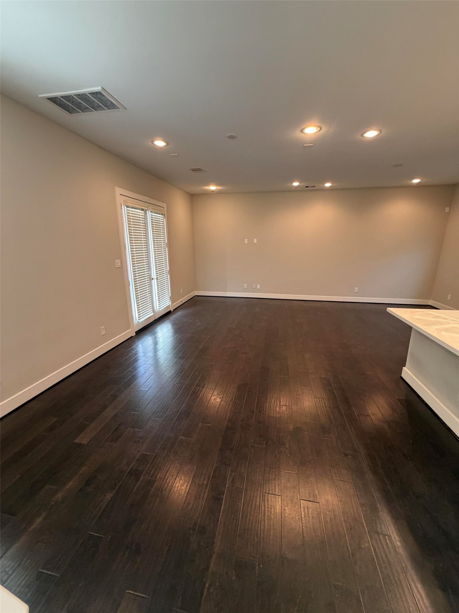 10806 Warwana Road, Unit A Houston, TX 77043 - Photo 14 of 37 a view of an empty room with wooden floor