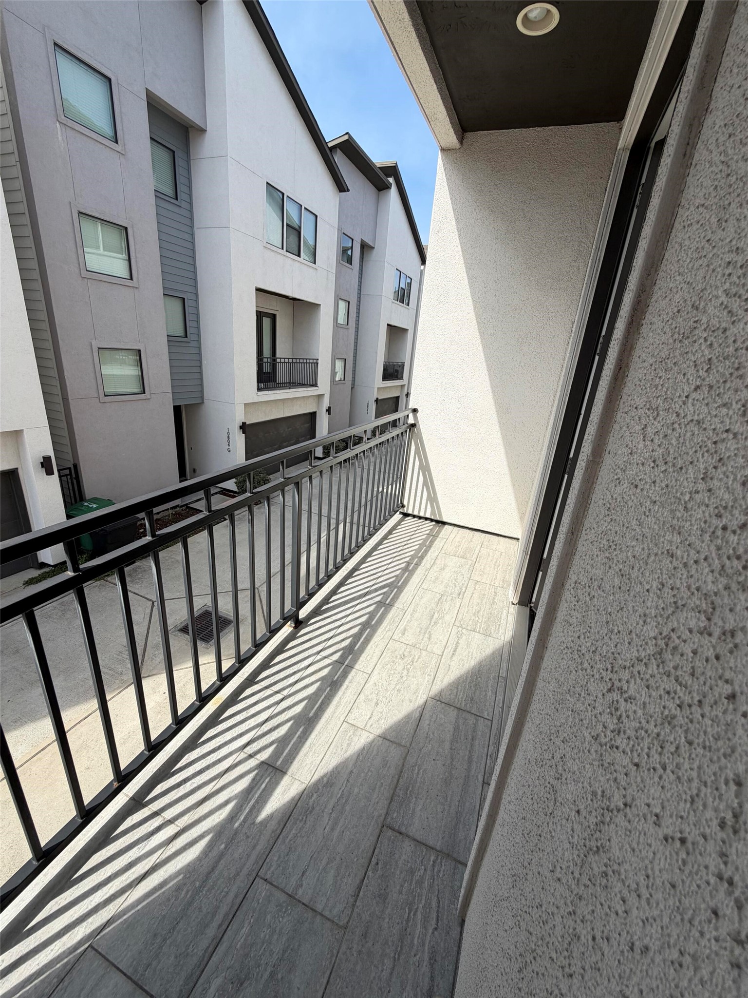 10806 Warwana Road, Unit A Houston, TX 77043 - Photo 16 of 37 a view of balcony with wooden floor