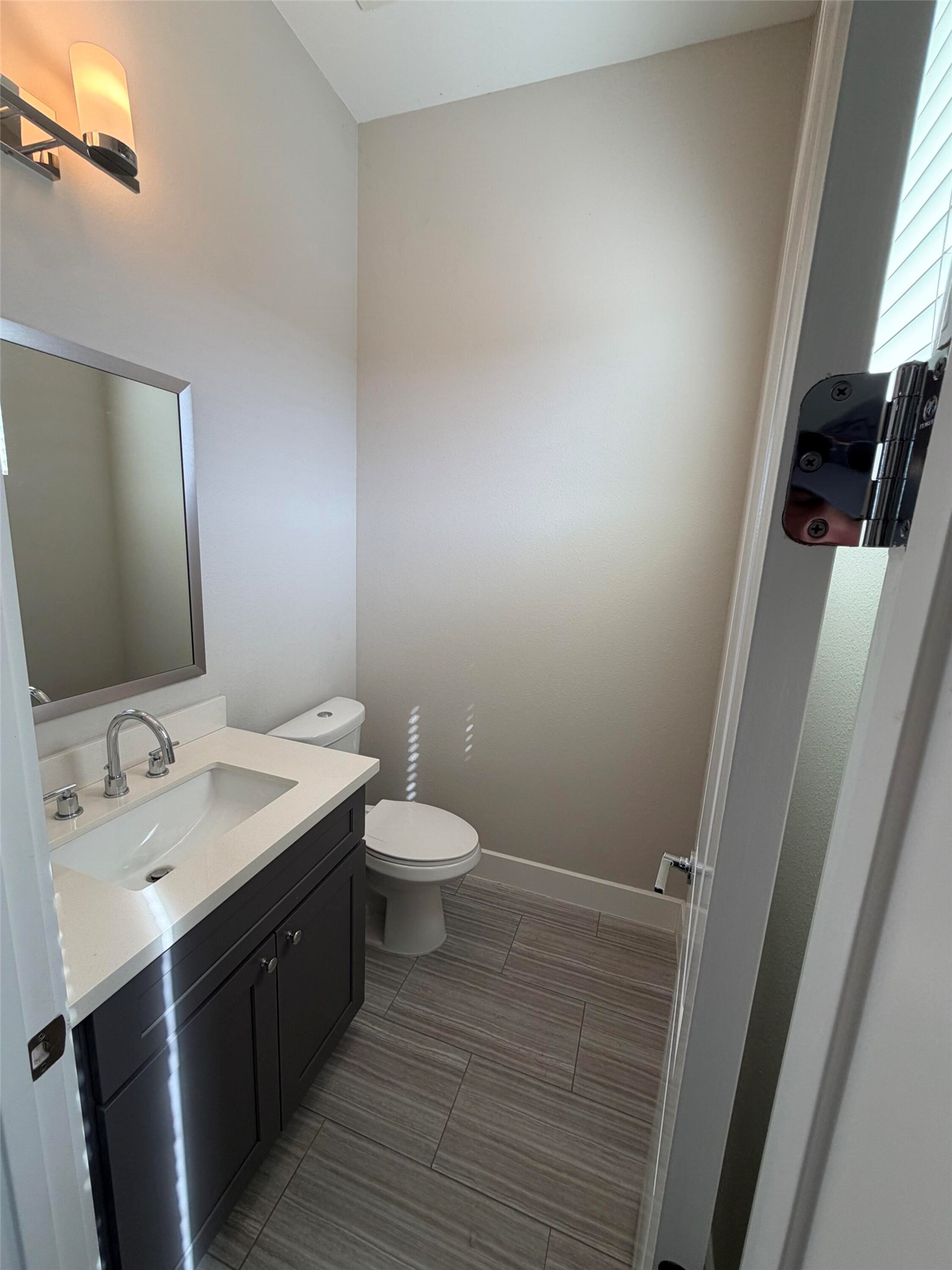 10806 Warwana Road, Unit A Houston, TX 77043 - Photo 20 of 37 a bathroom with a sink and a mirror