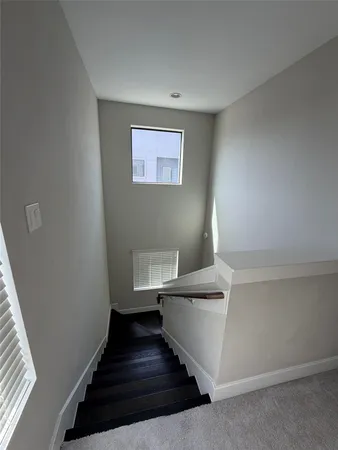 a view of a room with staircase