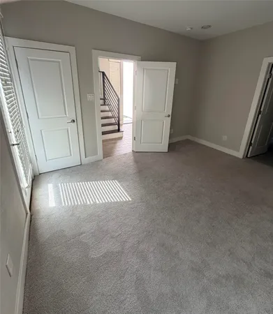 a view of a hallway and wooden floor