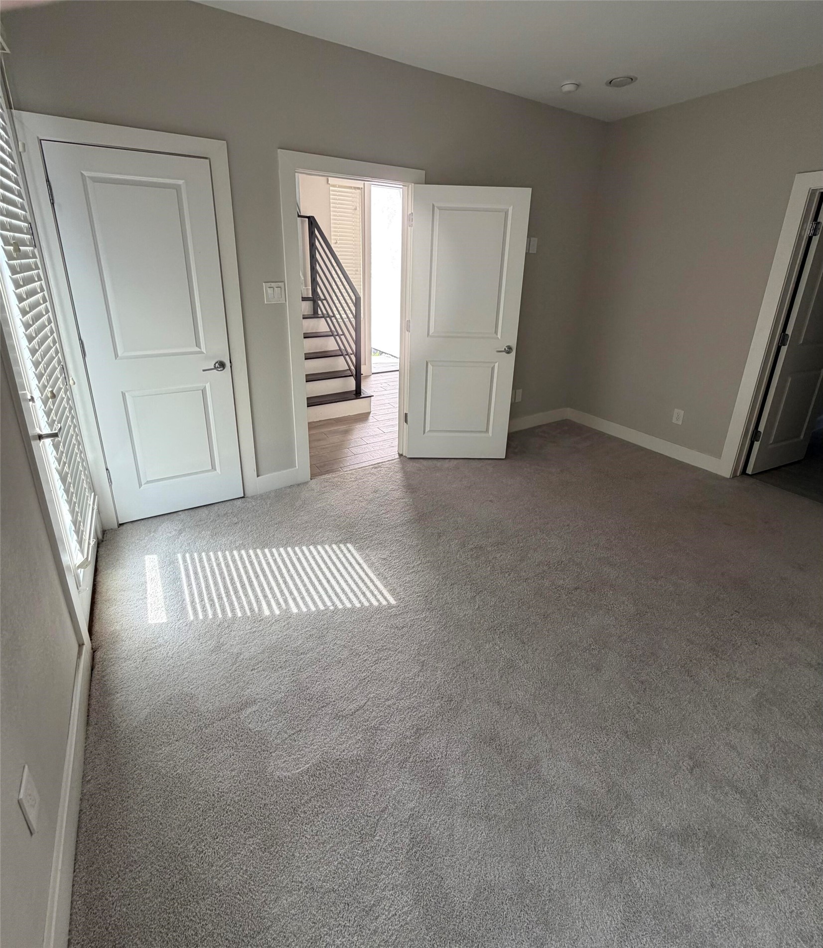 10806 Warwana Road, Unit A Houston, TX 77043 - Photo 7 of 37 an empty room with windows