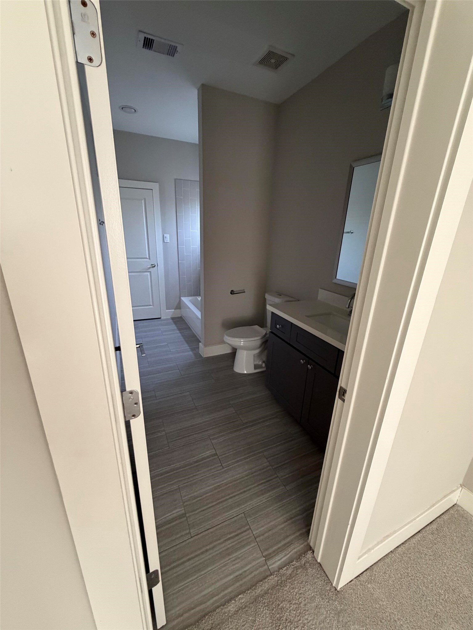 10806 Warwana Road, Unit A Houston, TX 77043 - Photo 8 of 37 a view of a hallway and wooden floor
