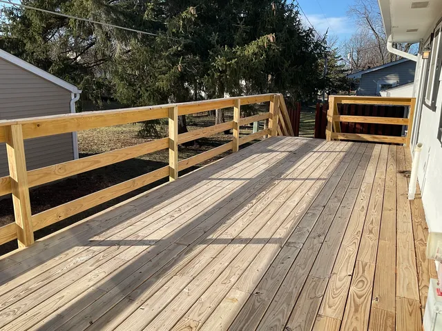 a view of balcony and deck with wooden floor and seating space