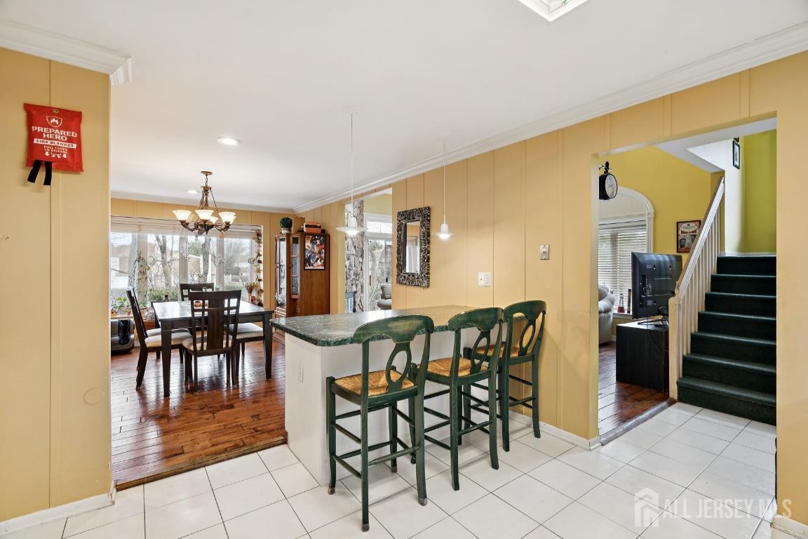 118 Coppertree Court Edison, NJ 08820 - Photo 12 of 38 a dining room with furniture and wooden floor