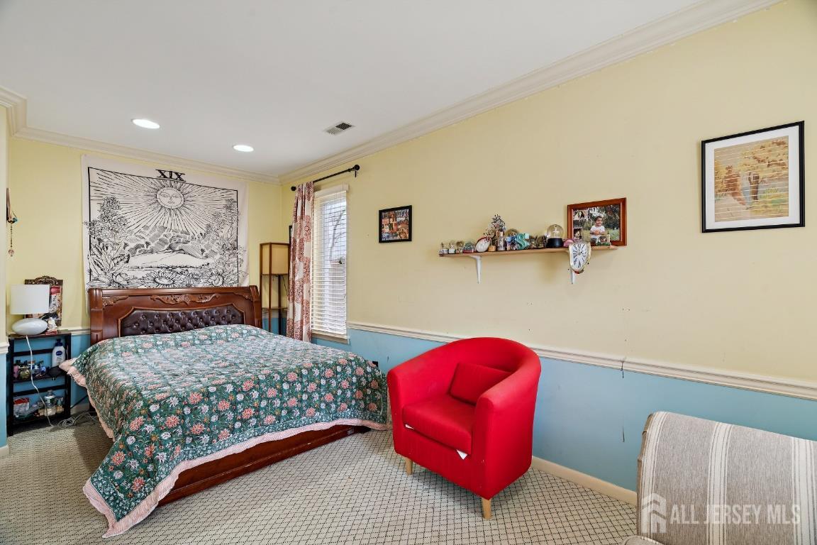118 Coppertree Court Edison, NJ 08820 - Photo 15 of 38 a bedroom with a bed and dresser with rug