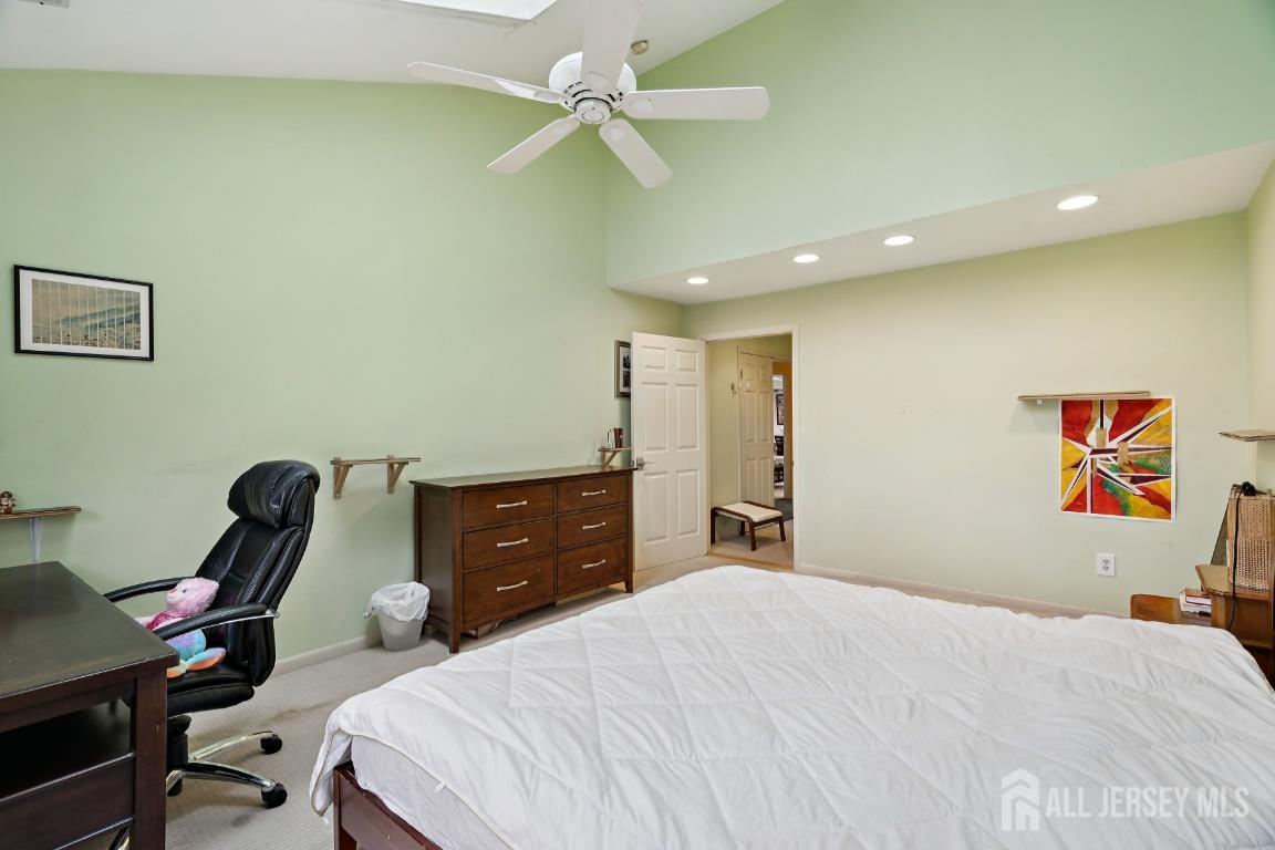 118 Coppertree Court Edison, NJ 08820 - Photo 20 of 38 a bedroom with a bed and a chandelier