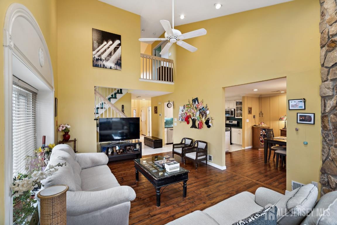 118 Coppertree Court Edison, NJ 08820 - Photo 7 of 38 a living room with furniture and a flat screen tv