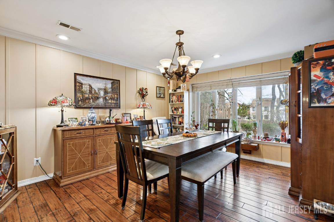 118 Coppertree Court Edison, NJ 08820 - Photo 8 of 38 a room with stainless steel appliances a table and chairs in it