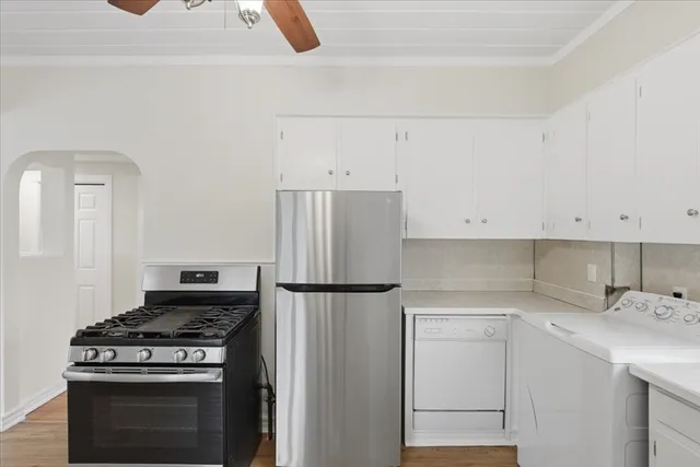 a kitchen with a stove and a refrigerator