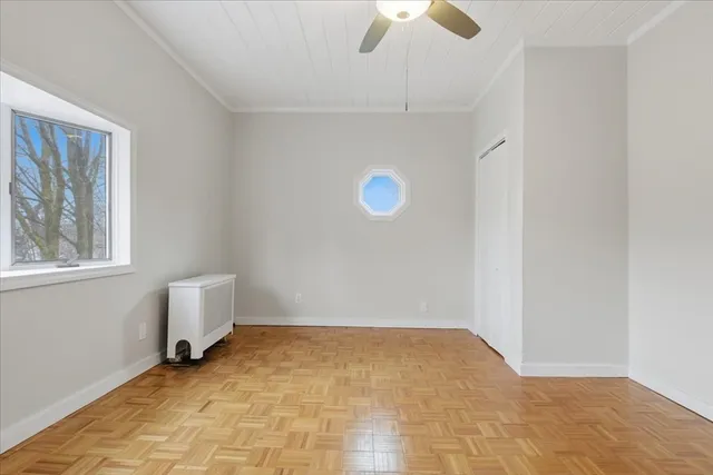 a view of room with window and ceiling fan