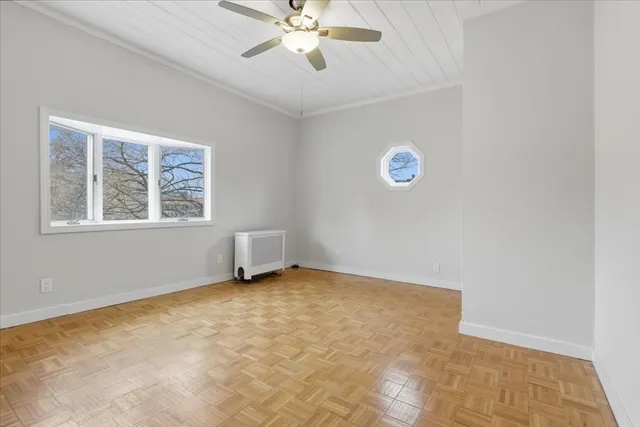 a view of an empty room with a window