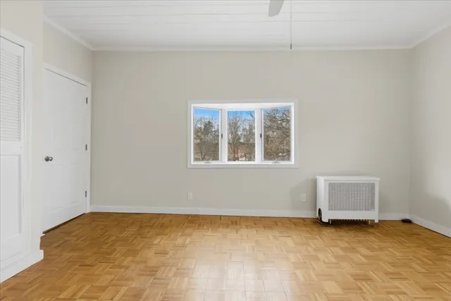 a view of an empty room with a window