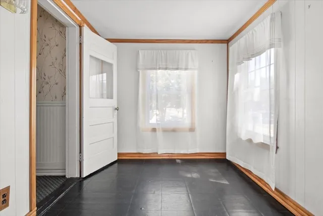 a backyard of a house with lots of green space and fountain