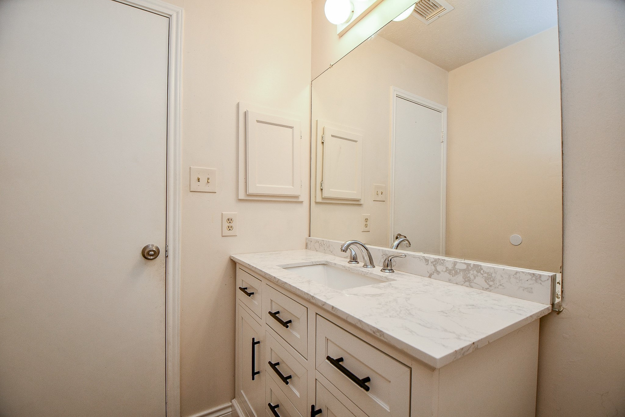 10919 Rustling Winds Drive Houston, TX 77064 - Photo 17 of 20 a bathroom with a sink vanity and a mirror