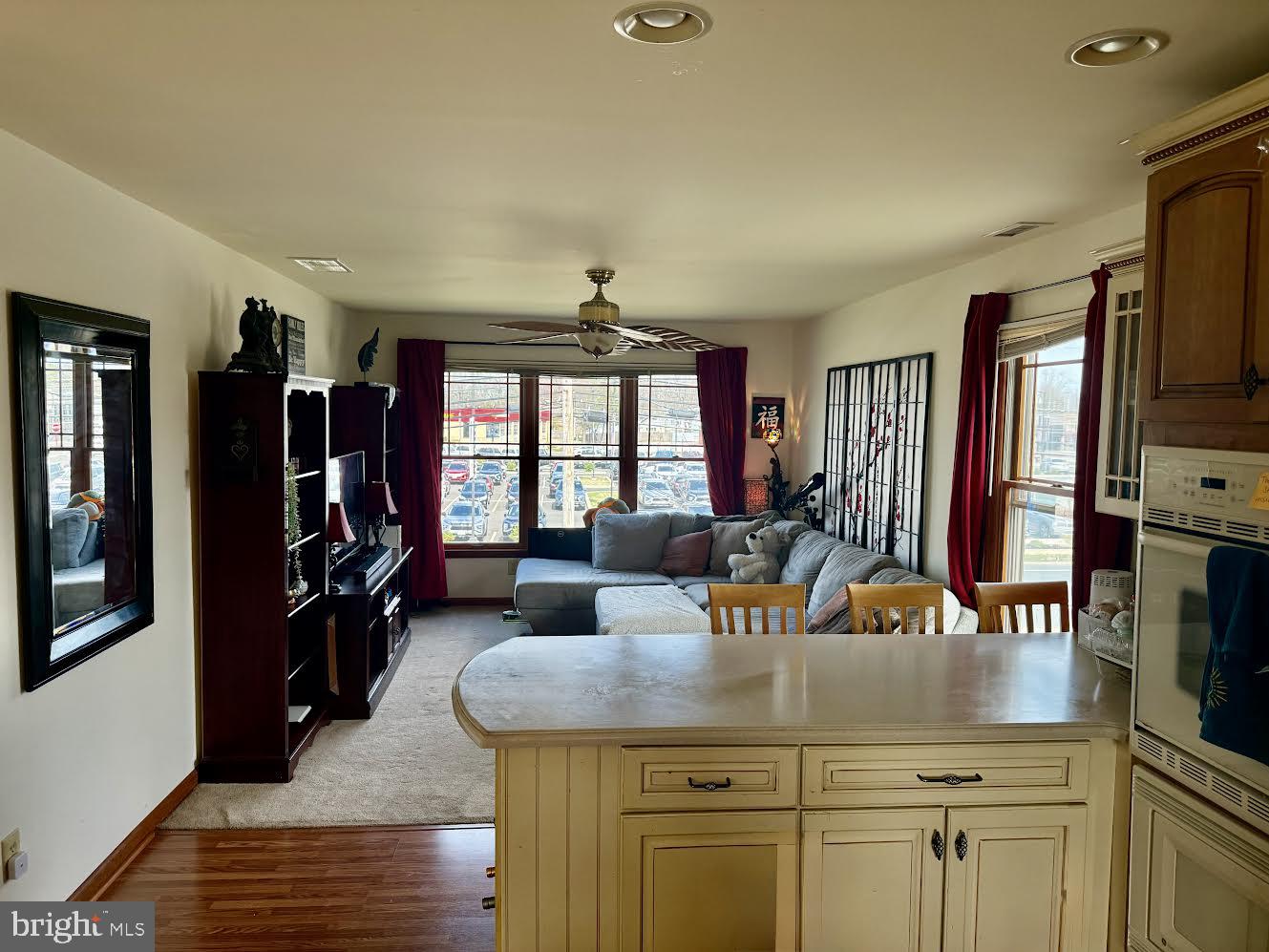 507 North Main Street Glassboro, NJ 08028 - Photo 2 of 15 a living room with furniture a flat screen tv and large window