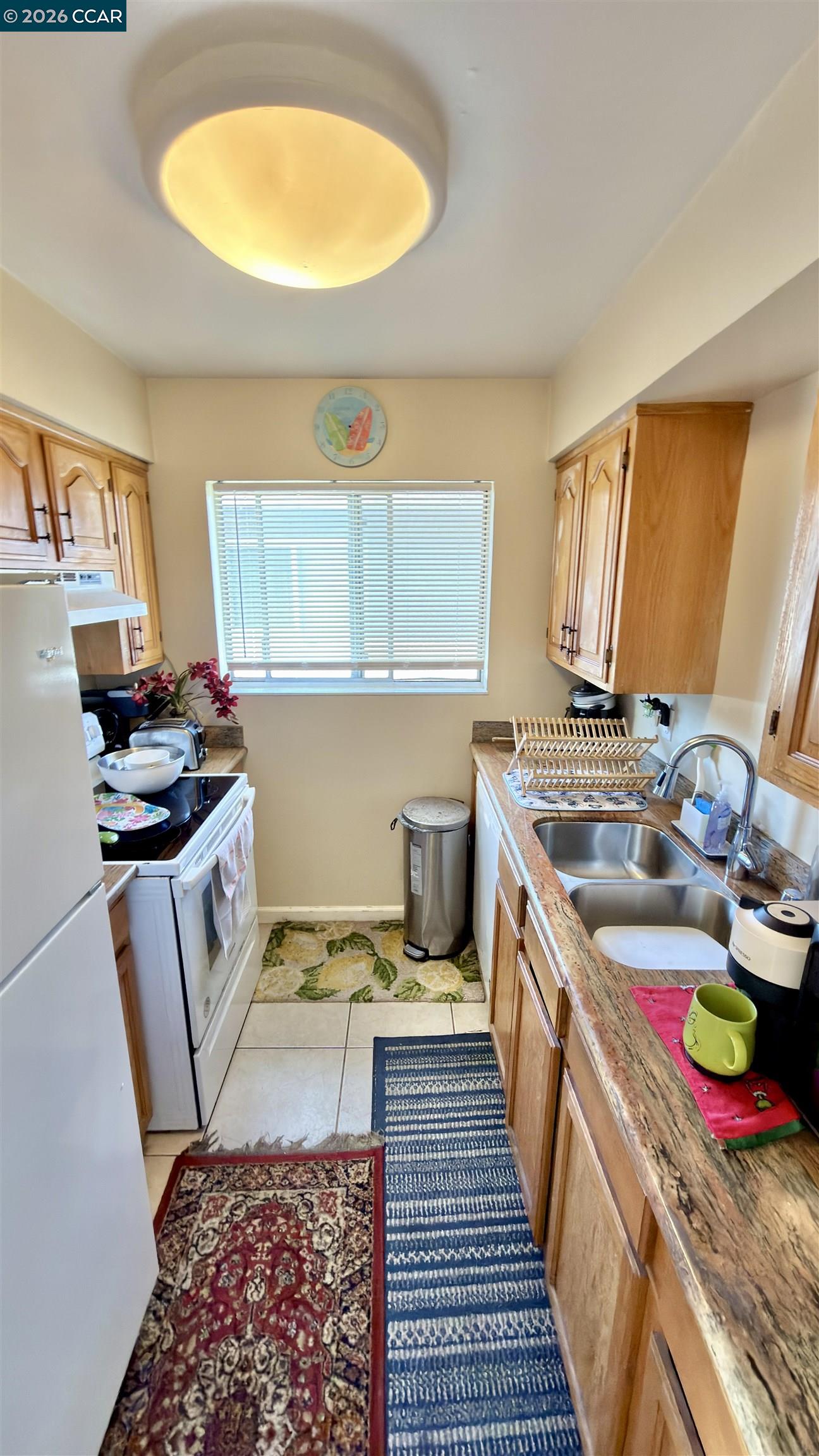 1360 Del Rio Court, Unit 4 Concord, CA 94518 - Photo 10 of 19 a kitchen with a sink stove and cabinets