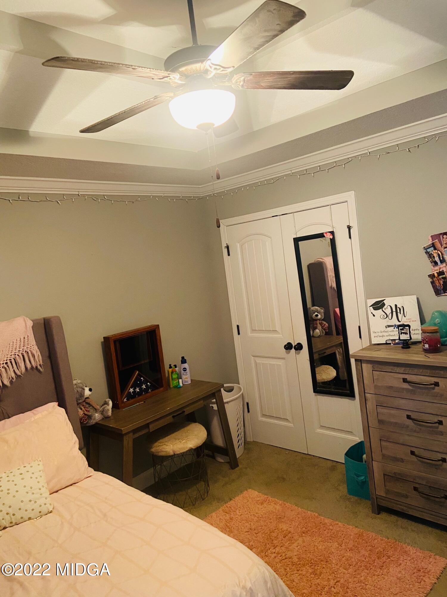 304 Durgin Drive Bonaire, GA 31005 - Photo 11 of 22 a bedroom with a bed and furniture