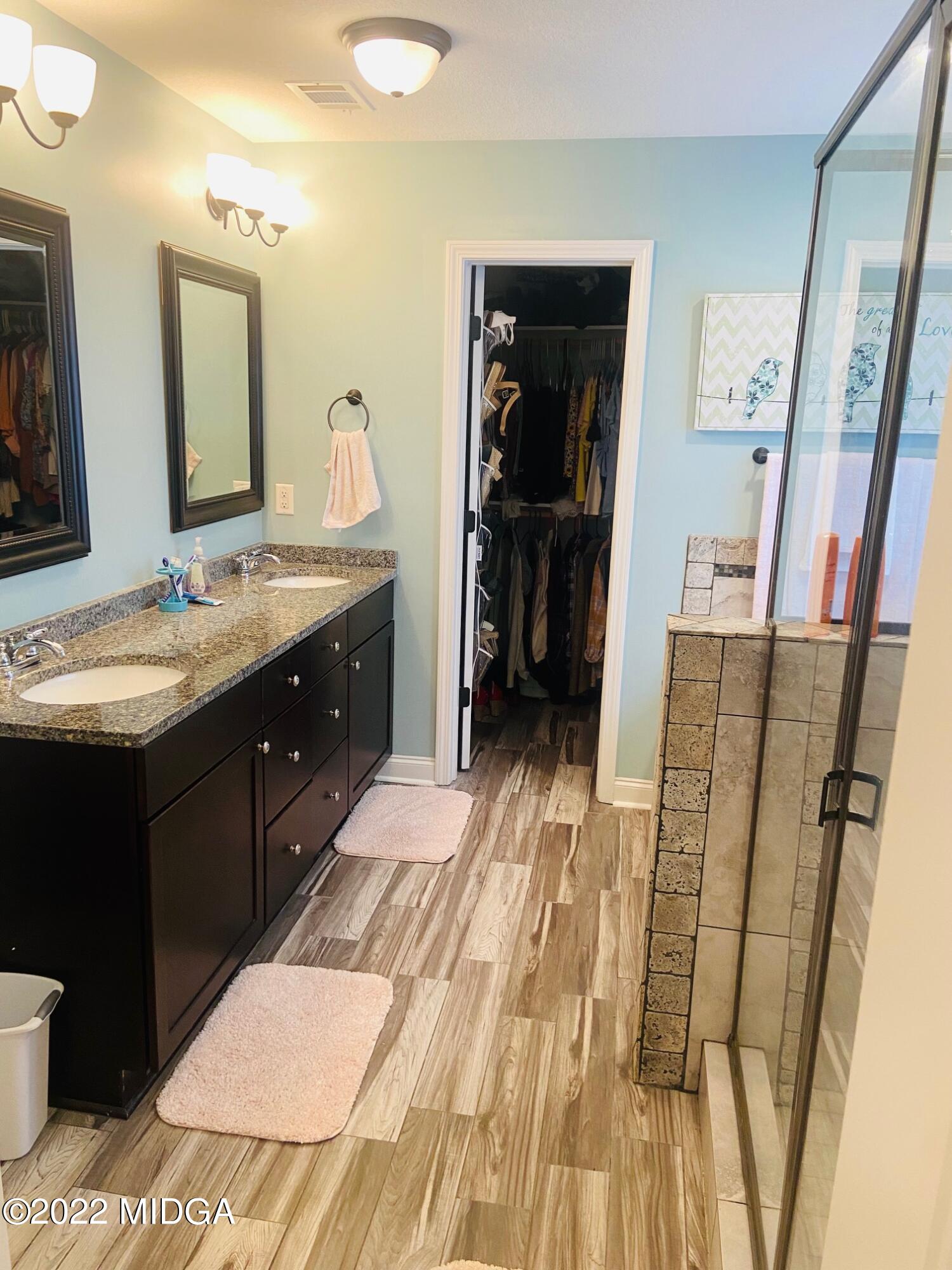 304 Durgin Drive Bonaire, GA 31005 - Photo 16 of 22 a bathroom with a sink a toilet and a mirror