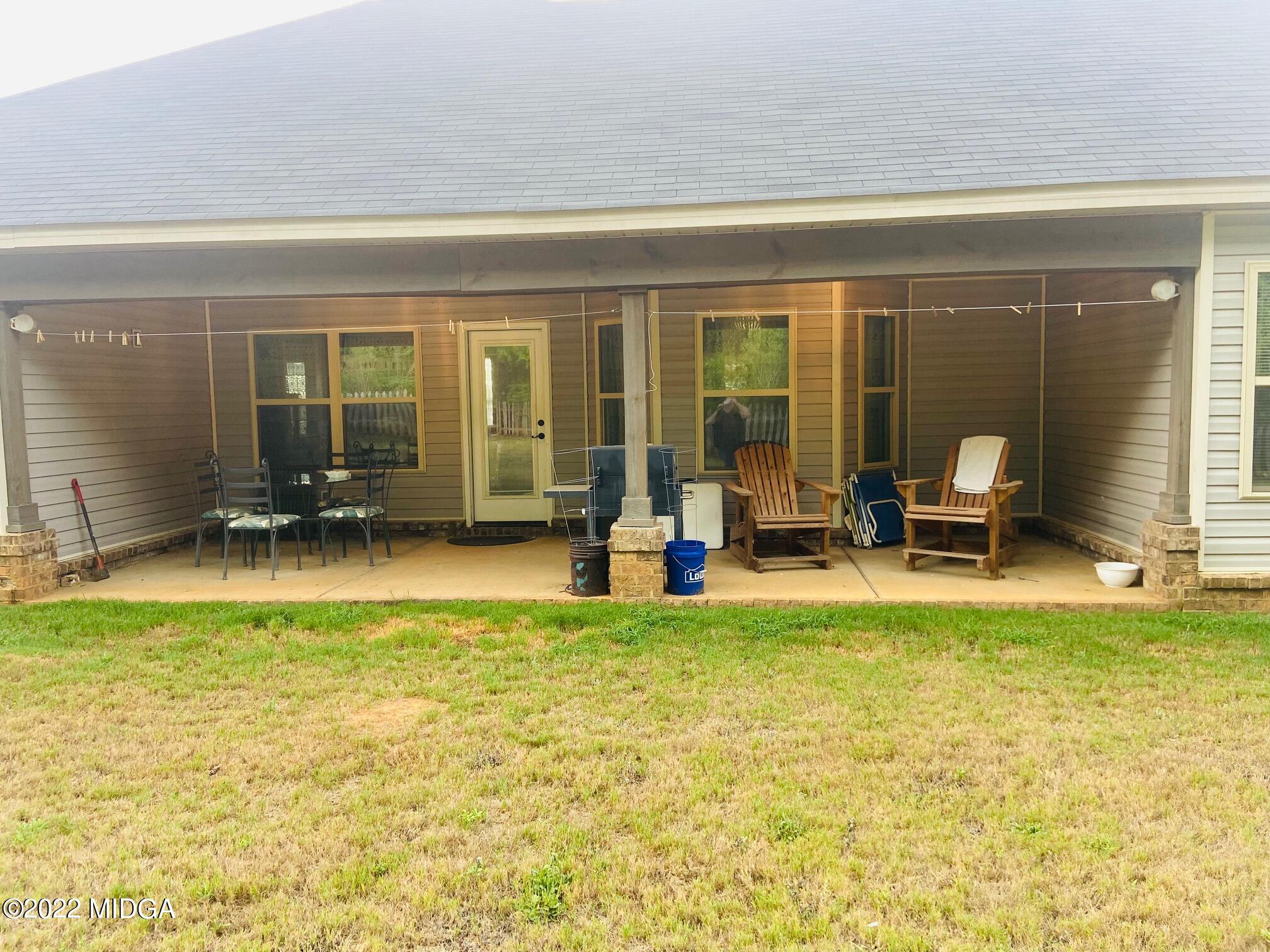 304 Durgin Drive Bonaire, GA 31005 - Photo 20 of 22 a view of a swimming pool with furniture