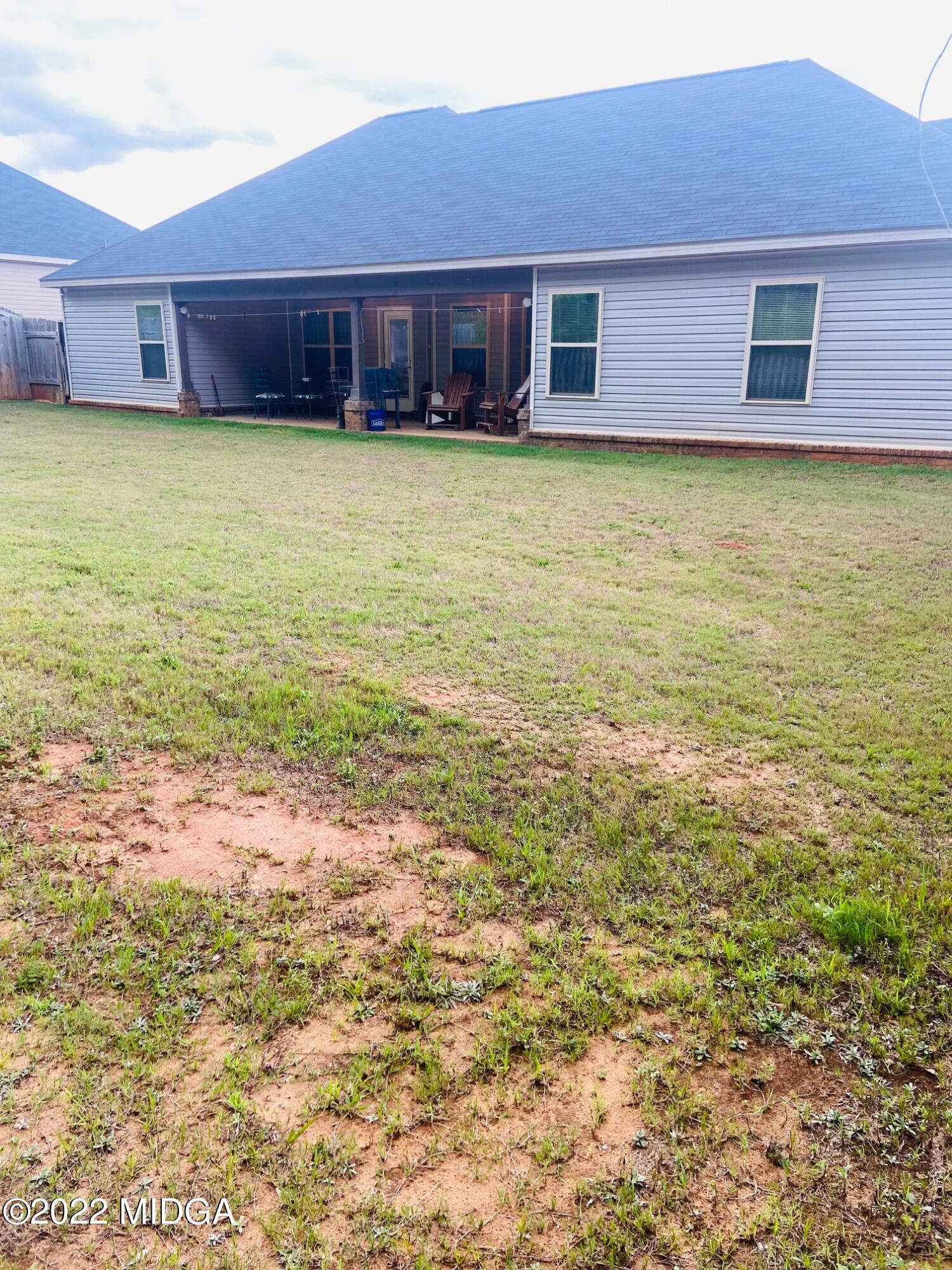 304 Durgin Drive Bonaire, GA 31005 - Photo 22 of 22 a view of a house with a backyard