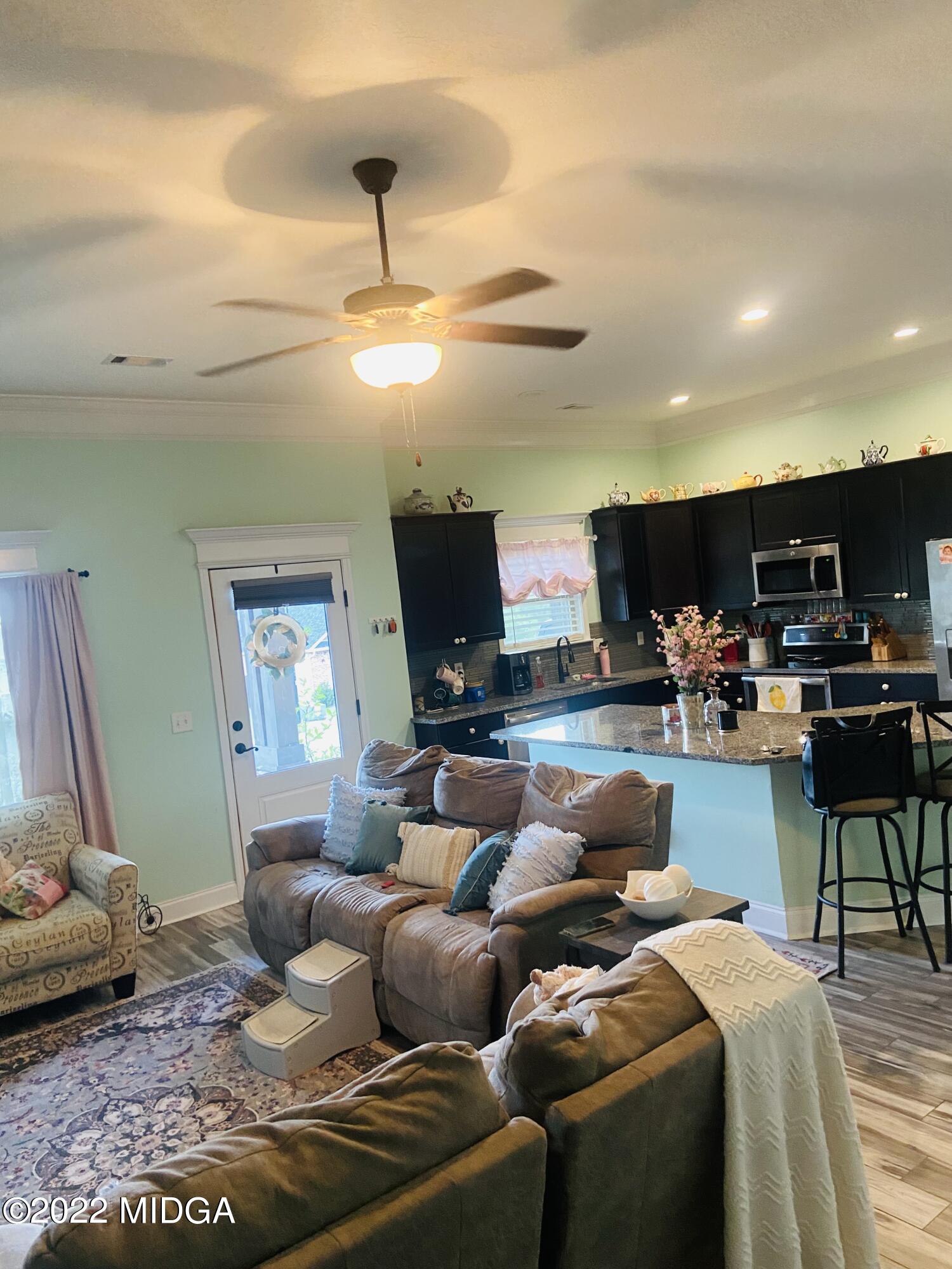 304 Durgin Drive Bonaire, GA 31005 - Photo 3 of 22 a living room with furniture kitchen view and a chandelier