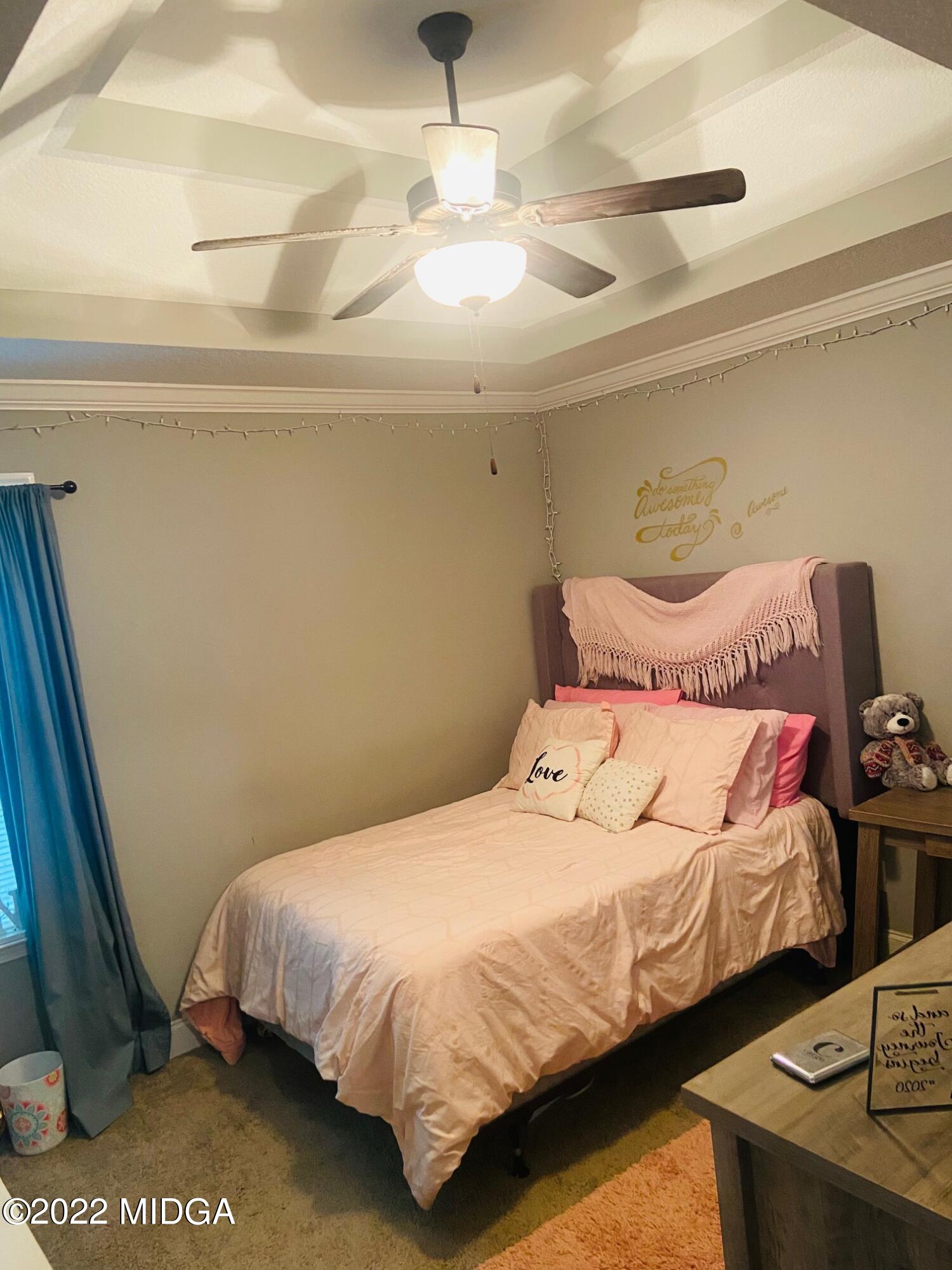 304 Durgin Drive Bonaire, GA 31005 - Photo 10 of 22 a bedroom with a bed and a night stand