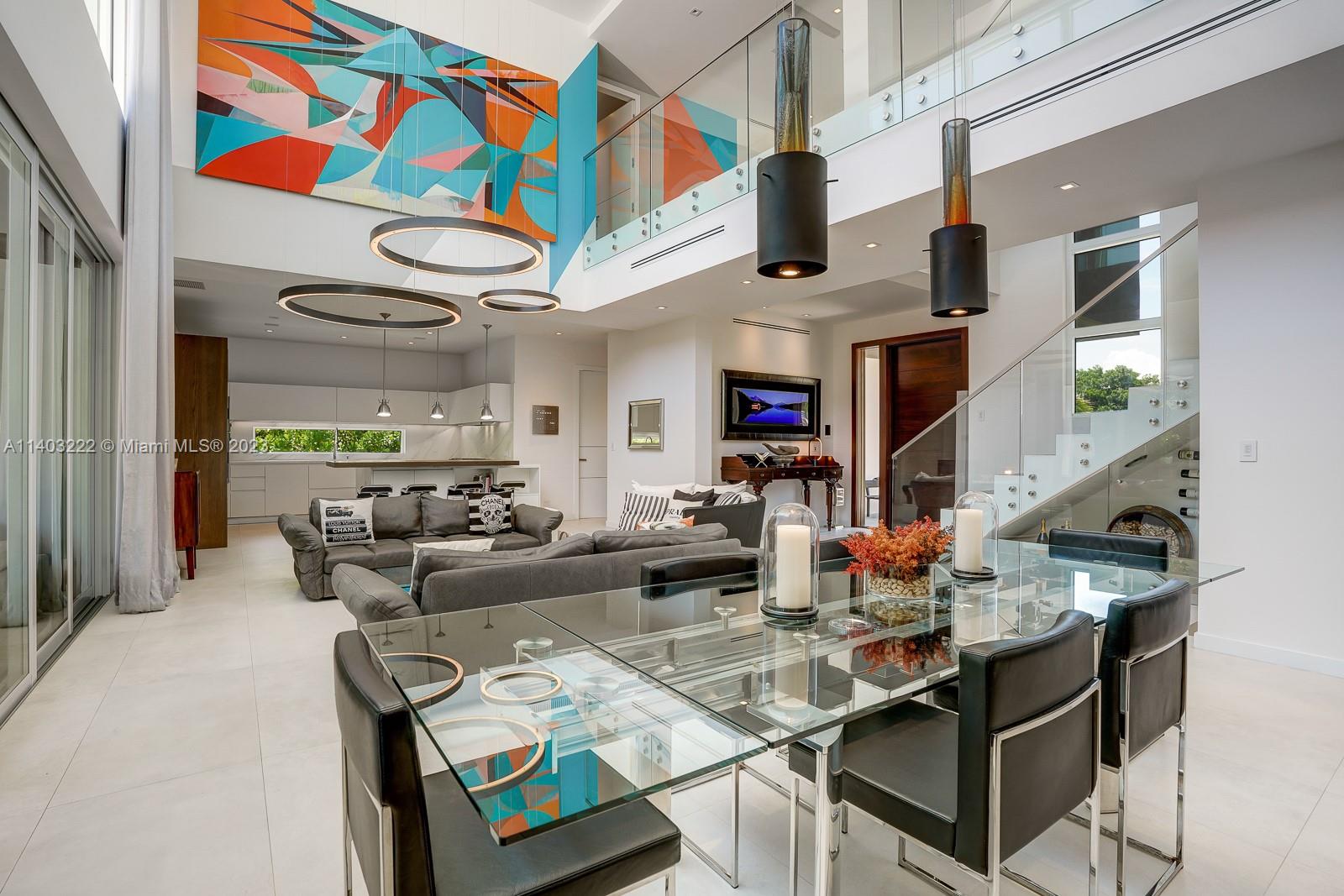 141 Harbor Drive Key Biscayne, FL 33149 - Photo 15 of 56 a living room with fireplace furniture and a painting on the wall